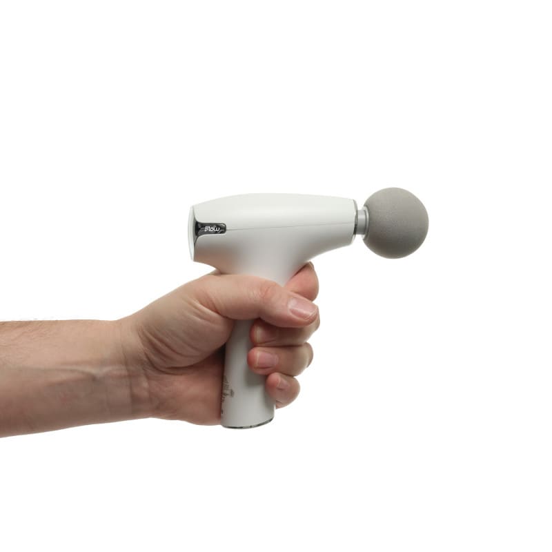 Flow NANO Massagepistole aktiviert - rote Wärmeanzeige leuchtet während der Therapie - Med-Praxisbedarf