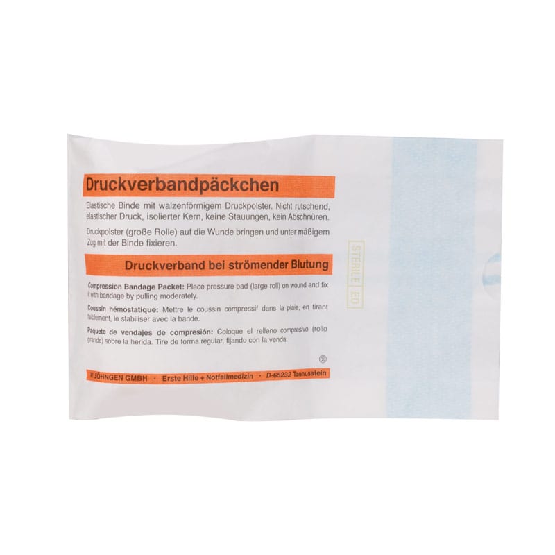 Spezial-Verbandpäckchen - geöffnetes Verbandpäckchen zeigt Kompresse und Binde - Med-Praxisbedarf
