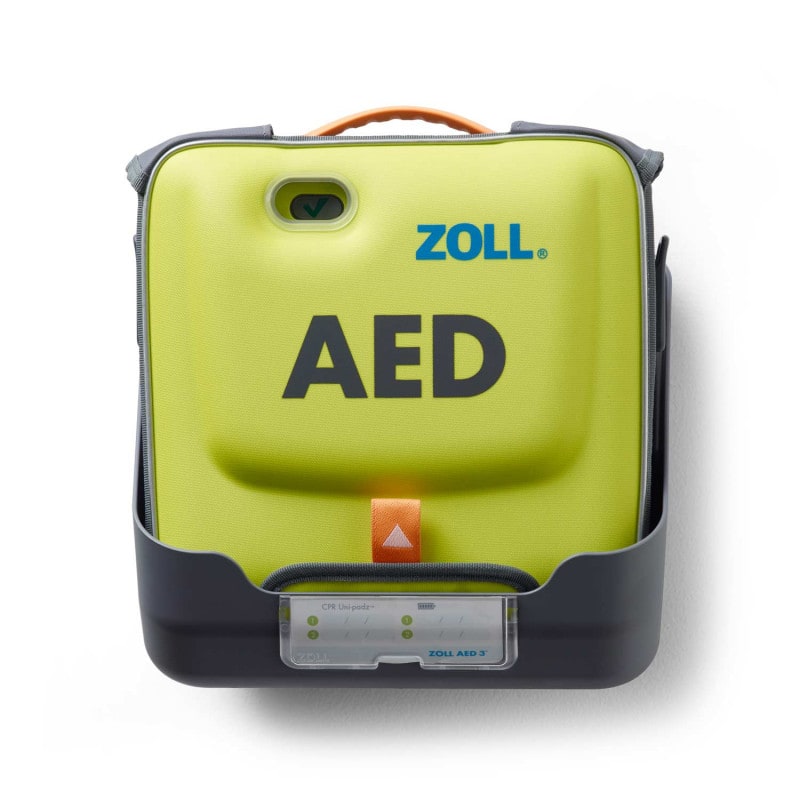 AED 3 Wandhalterung montiert - zeigt die Halterung mit befestigtem Defibrillator an der Wand - Med-Praxisbedarf